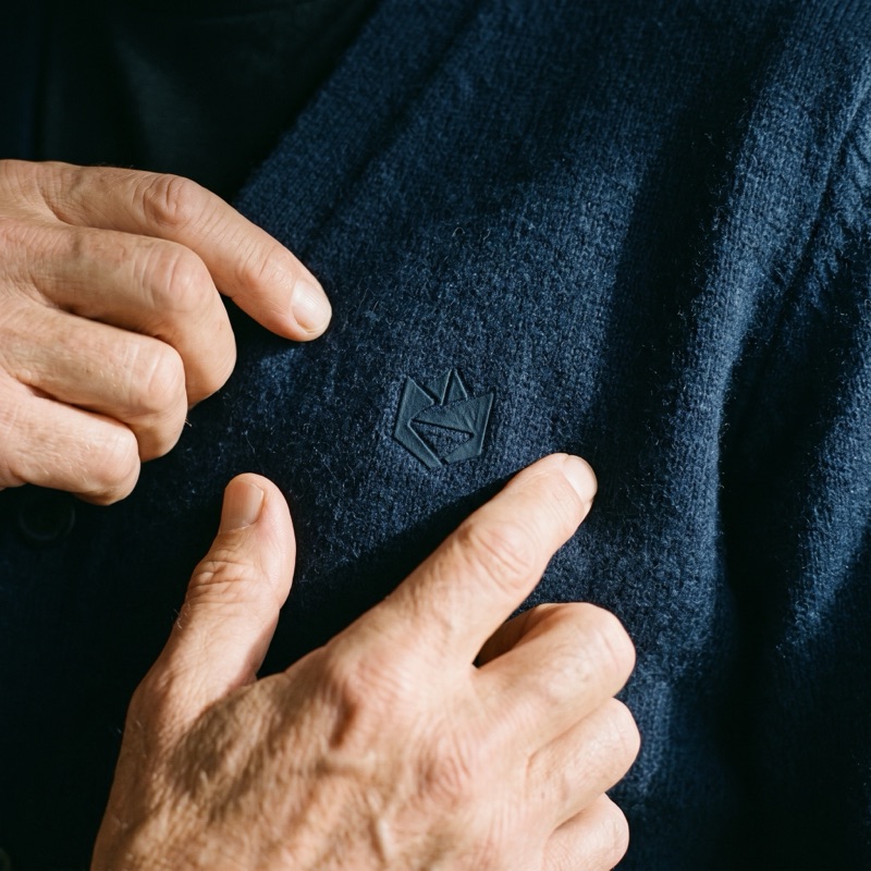 A fingertip sliding across a flush DTF print
